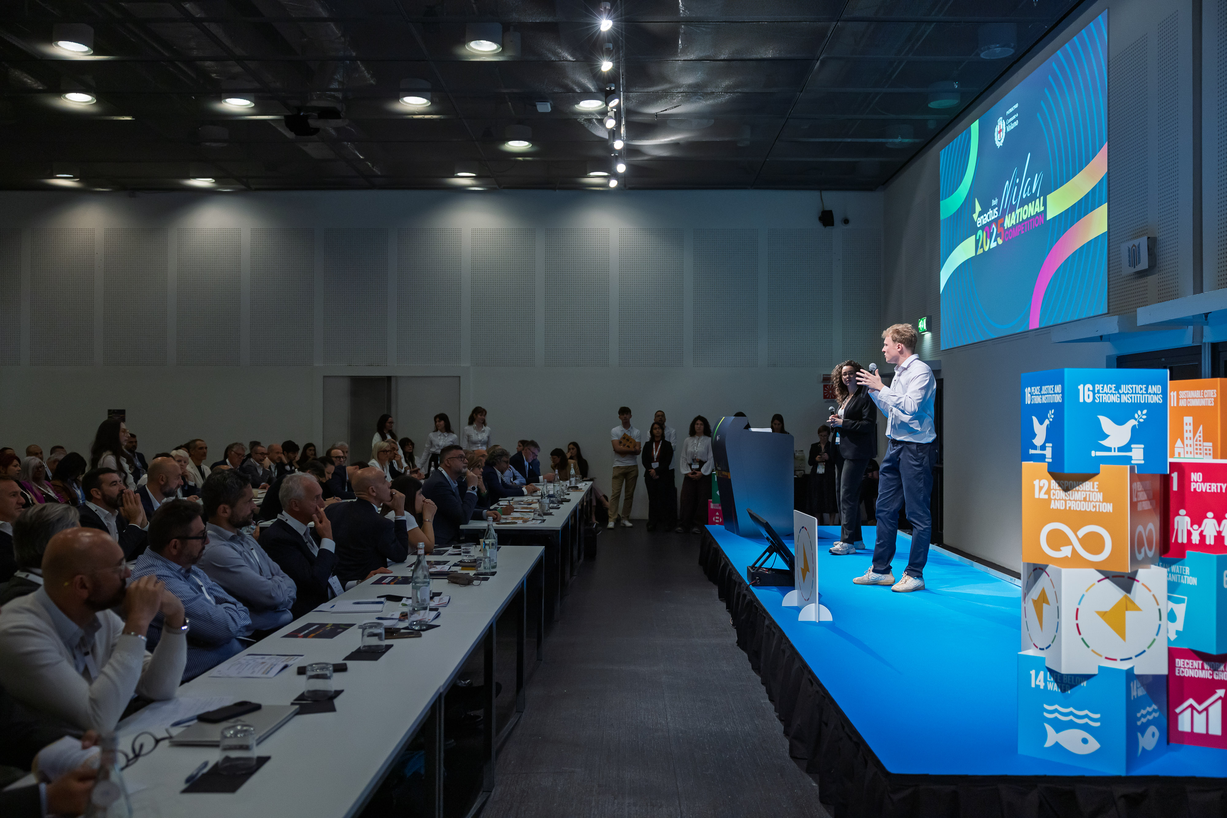 Pitching HomeLinkHer on stage at the Enactus Italy National Competition in Milan